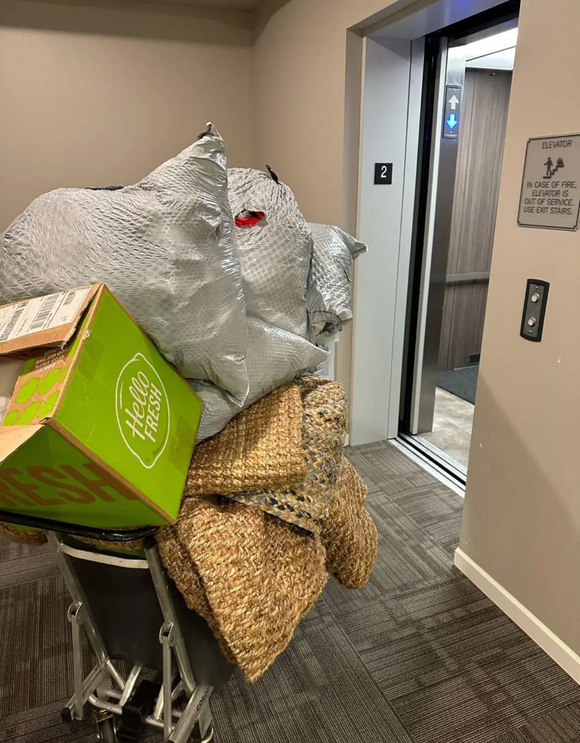Bagged junk being moved into an elevator for haul-away